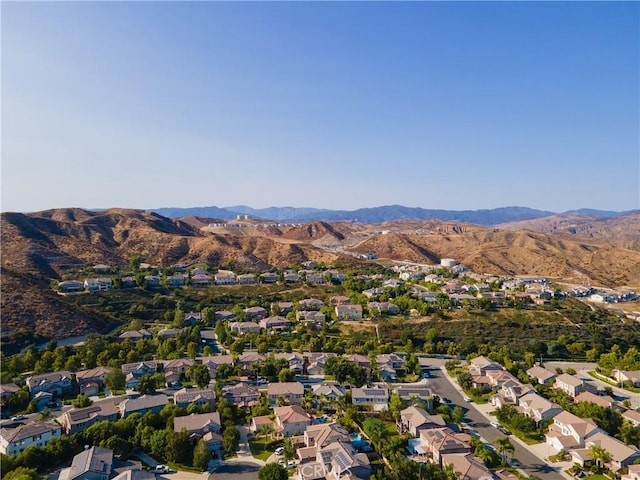 drone / aerial view featuring a mountain view and a residential view