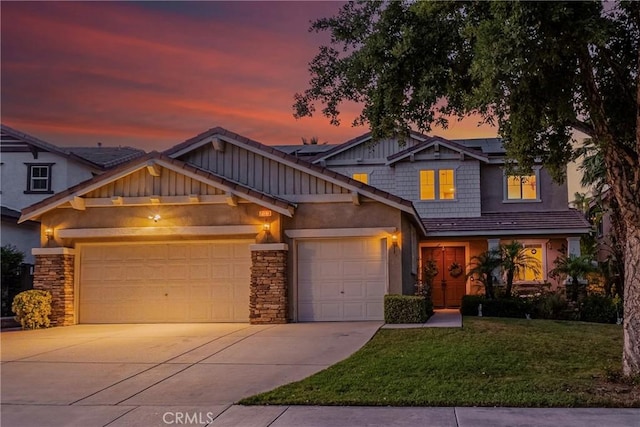 craftsman house featuring solar panels, concrete driveway, an attached garage, board and batten siding, and a front yard