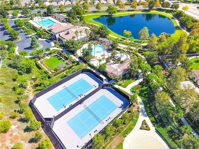 birds eye view of property with a water view