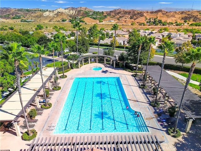 view of swimming pool featuring a mountain view