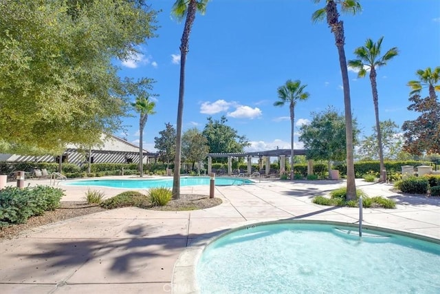 community pool featuring a patio and a pergola