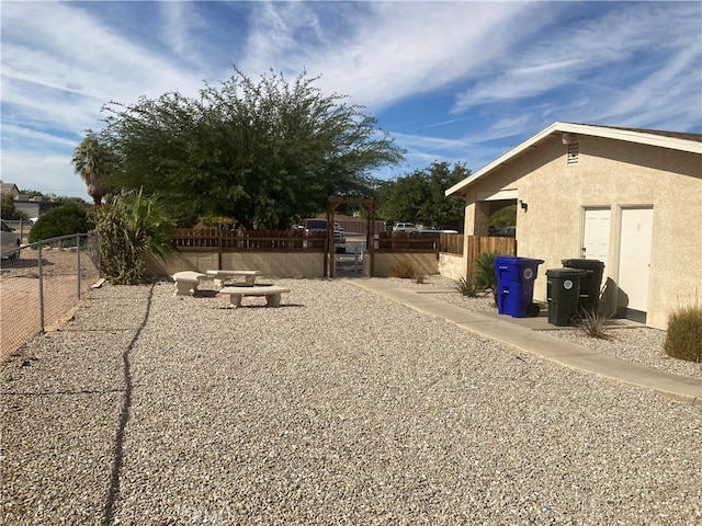 view of yard with a patio and a fire pit