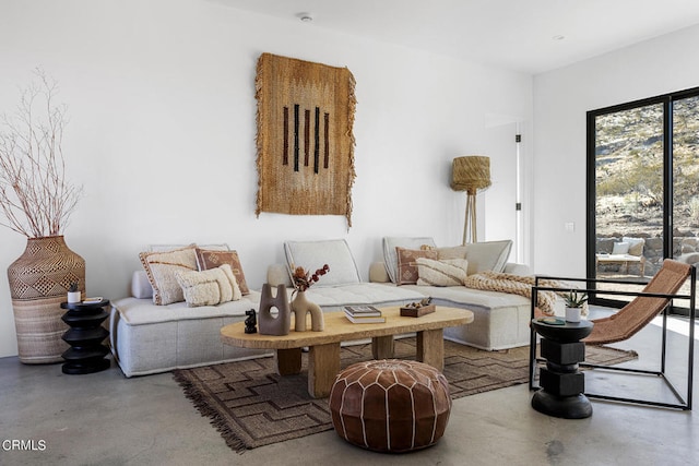 living room featuring concrete flooring