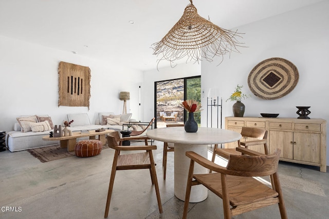 dining area featuring a chandelier