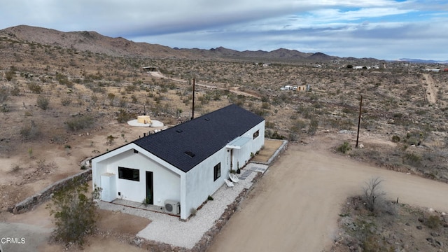 drone / aerial view featuring a mountain view