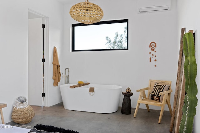 bathroom featuring a wall mounted AC, a washtub, and concrete floors