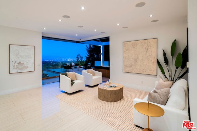 living room featuring a wall of windows