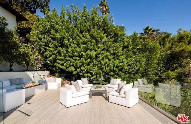 wooden terrace with outdoor lounge area