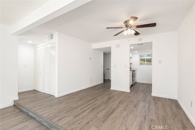 35104 Mesa Grande Dr, Calimesa, CA 92320 - spare room featuring visible vents, light wood finished floors, baseboards, and ceiling fan
