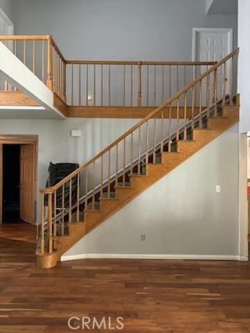 stairs featuring wood-type flooring