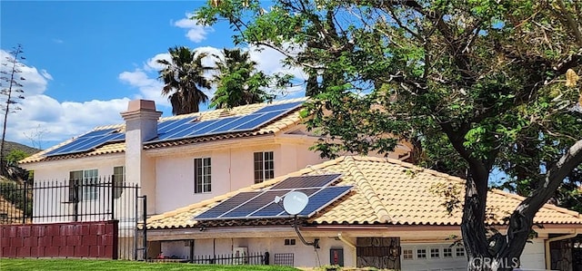 back of property with solar panels