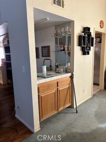 bar with stainless steel refrigerator