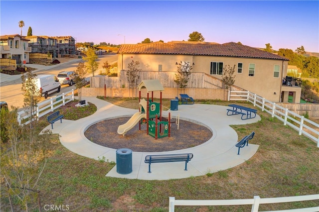 view of home's community featuring a playground