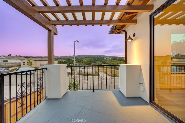 view of balcony at dusk