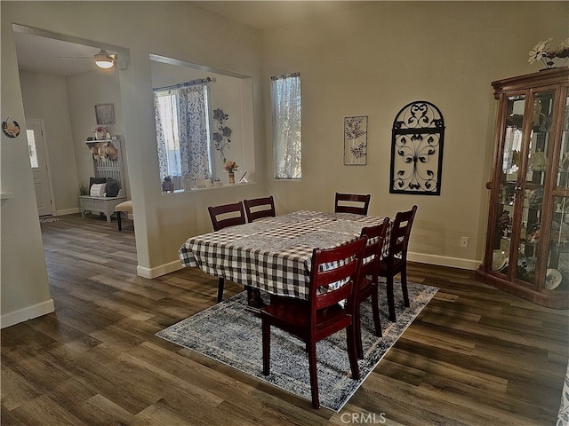 dining room with dark hardwood / wood-style floors and ceiling fan