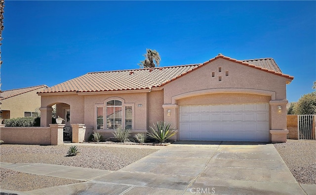 mediterranean / spanish house with a garage