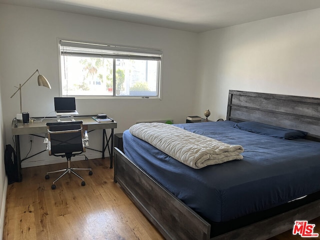 bedroom featuring wood-type flooring