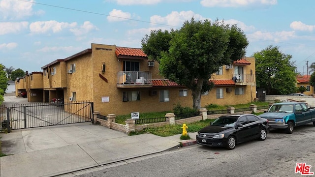 view of front of property with a balcony