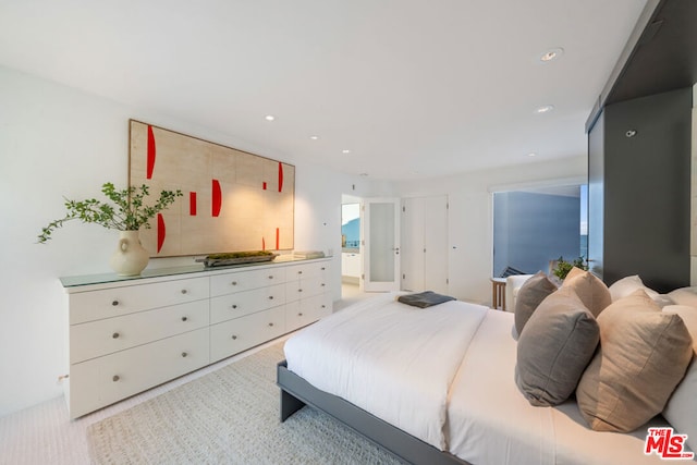 bedroom with light colored carpet