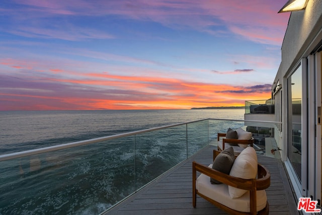 balcony at dusk with a water view