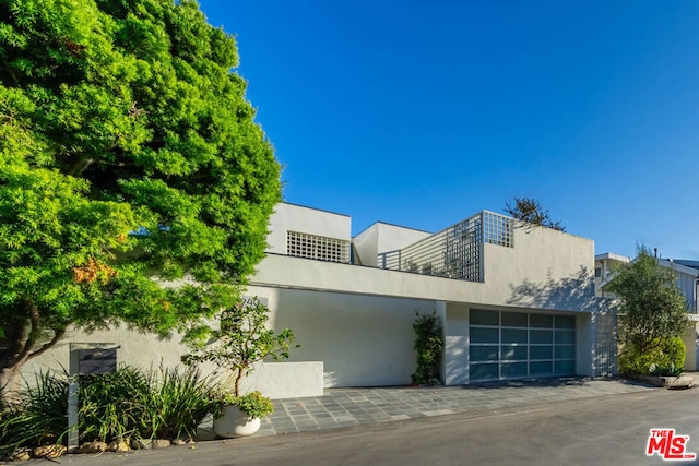 view of front of property with a garage