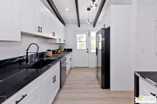 kitchen with sink, white cabinetry, and stainless steel appliances