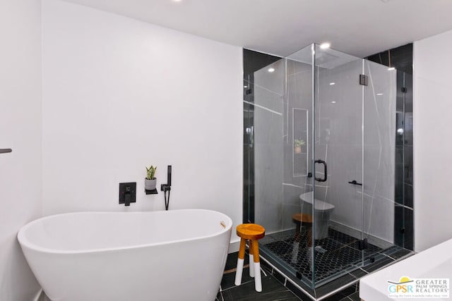 bathroom with tile patterned floors and separate shower and tub