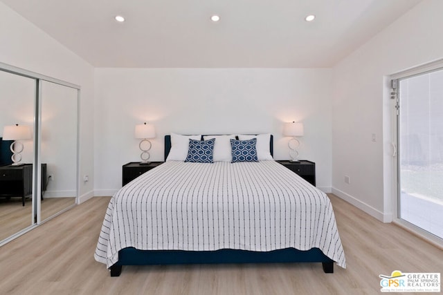 bedroom featuring light hardwood / wood-style floors and a closet