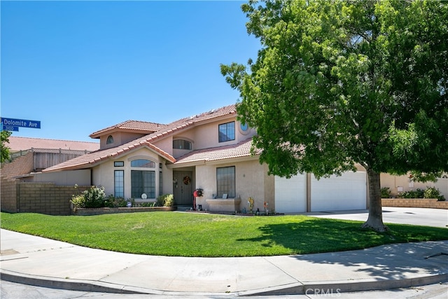 view of front of home with a front yard and a garage