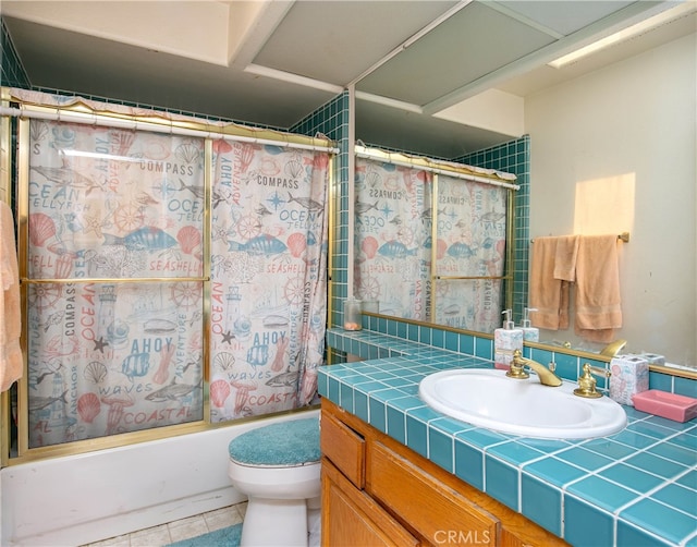 full bathroom featuring vanity, tile patterned flooring, toilet, and shower / tub combo with curtain