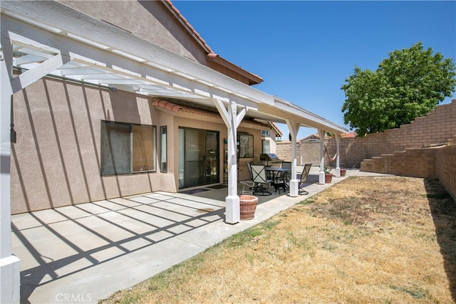 back of house with a patio