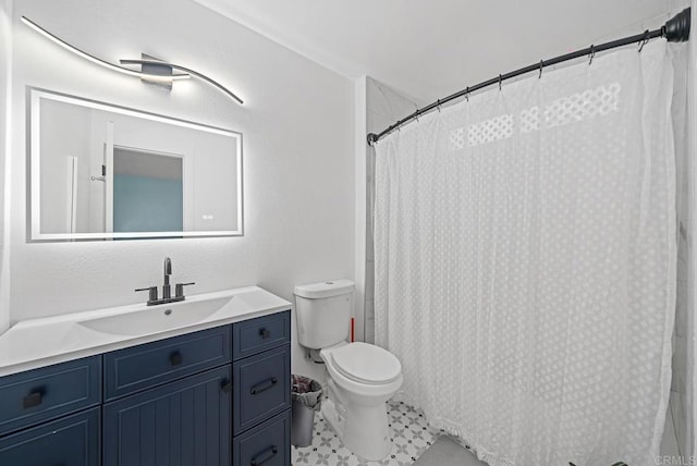 bathroom featuring a shower with shower curtain, tile patterned floors, vanity, and toilet