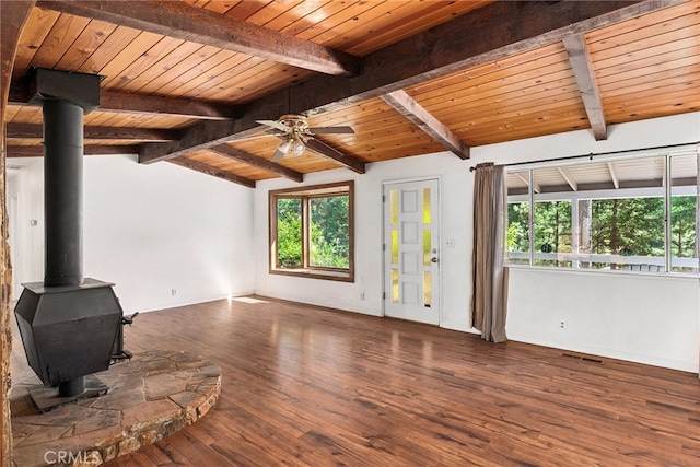 unfurnished living room with wood ceiling, ceiling fan, vaulted ceiling with beams, dark hardwood / wood-style flooring, and a wood stove