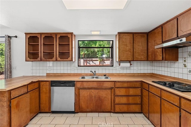 kitchen with black electric cooktop, plenty of natural light, dishwasher, and sink