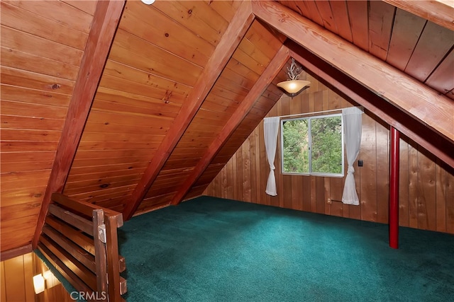 additional living space with vaulted ceiling with beams, wood ceiling, and dark colored carpet