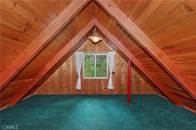 additional living space featuring wooden walls, carpet flooring, wood ceiling, and lofted ceiling with beams