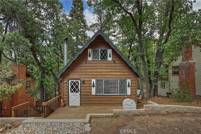 rustic home with a wooden deck