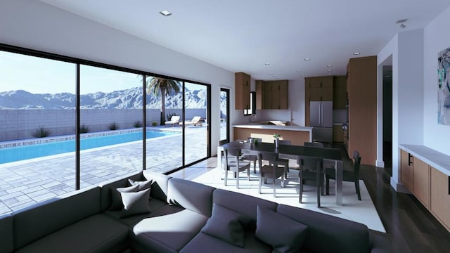 living room featuring a wealth of natural light and a mountain view