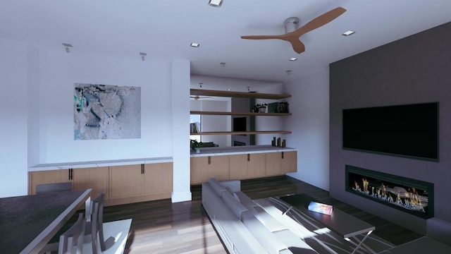 living room with ceiling fan and dark hardwood / wood-style floors