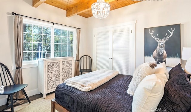 bedroom with wood ceiling, beam ceiling, multiple windows, and a notable chandelier