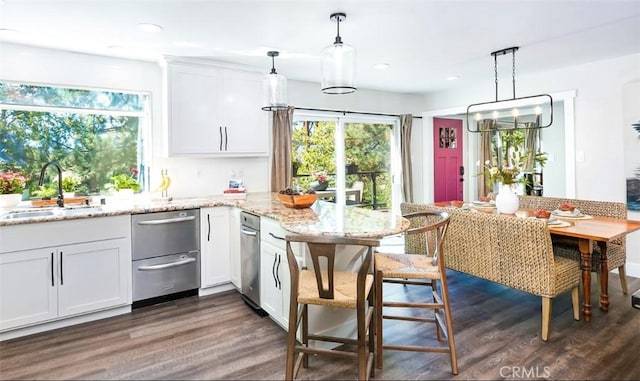514 Emerald Dr, Lake Arrowhead, CA 92352 - kitchen featuring a sink, dark wood-style flooring, stainless steel dishwasher, white cabinetry, and a peninsula