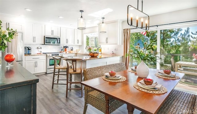 514 Emerald Dr, Lake Arrowhead, CA 92352 - dining space featuring light wood finished floors, recessed lighting, and a chandelier