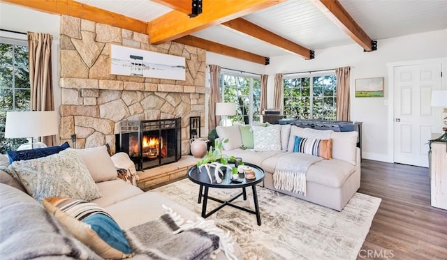 living room with beam ceiling, dark hardwood / wood-style floors, and a fireplace