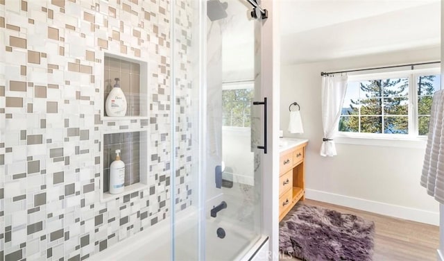 514 Emerald Dr, Lake Arrowhead, CA 92352 - full bath featuring enclosed tub / shower combo, baseboards, healthy amount of natural light, and wood finished floors