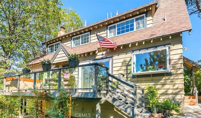 514 Emerald Dr, Lake Arrowhead, CA 92352 - back of property with a chimney and a deck
