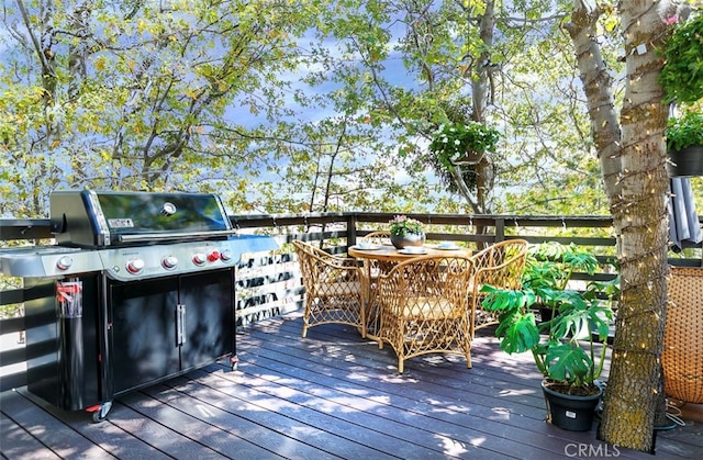 wooden terrace with area for grilling