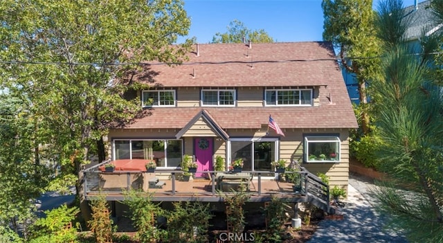 rear view of house with a deck