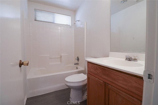 full bathroom with washtub / shower combination, vanity, toilet, and hardwood / wood-style floors