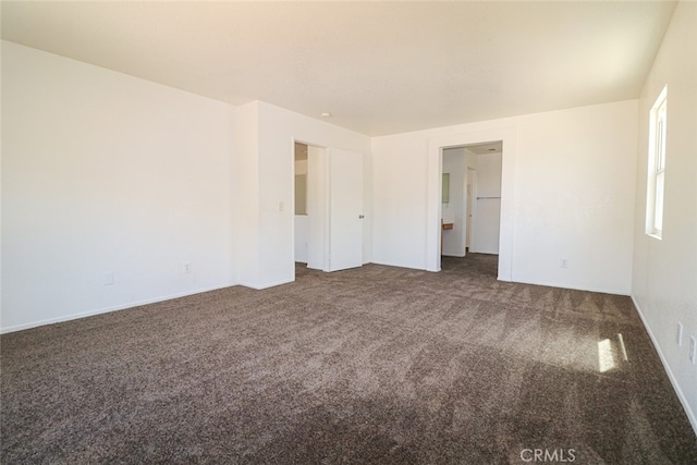 empty room with dark carpet