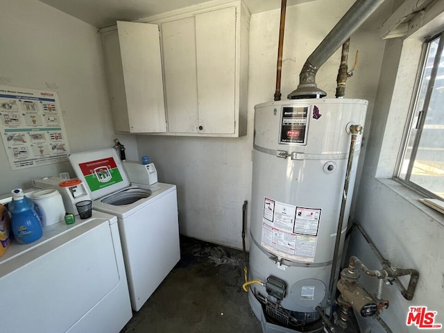 utility room with washer and clothes dryer and secured water heater